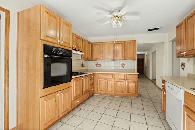 kitchen featuring decorative backsplash, white dishwasher, gas stovetop, light tile patterned floors, and black oven