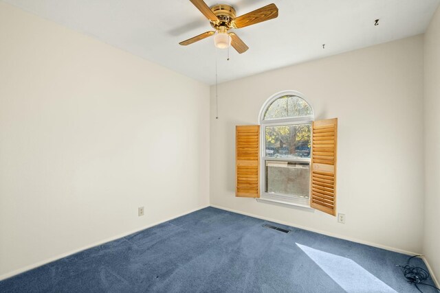 bathroom with tile patterned flooring, vanity, and walk in shower