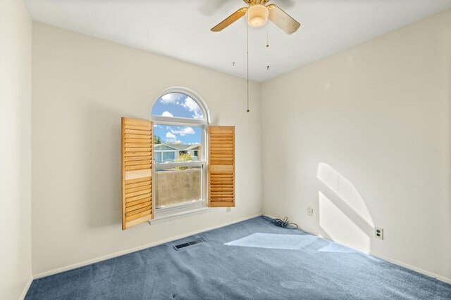 spare room with ceiling fan and carpet floors