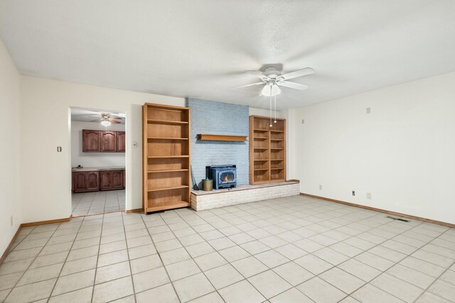 unfurnished room with ceiling fan, light wood-type flooring, and baseboard heating