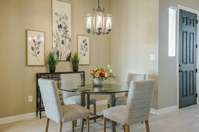 dining space featuring a notable chandelier