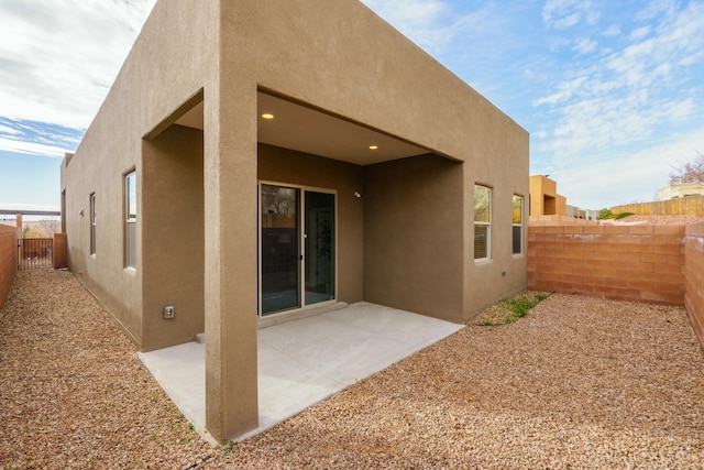 back of house featuring a patio area