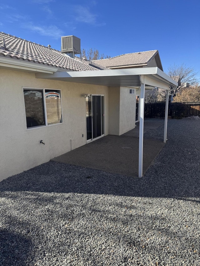 back of house featuring a patio and central air condition unit