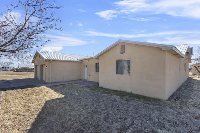 view of side of property with a garage