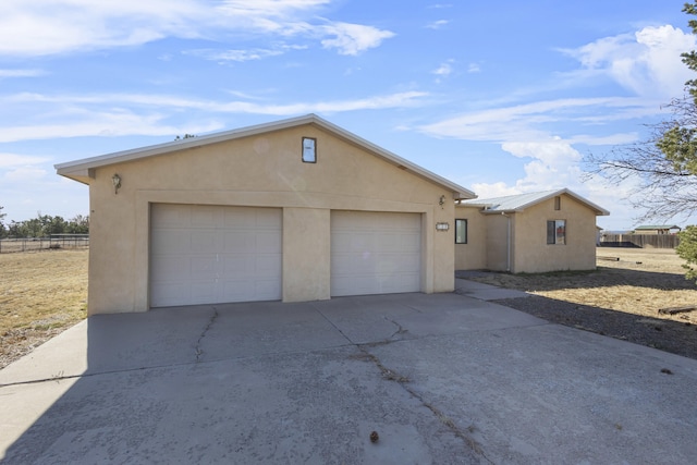 ranch-style house featuring a garage