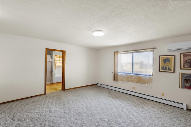 carpeted spare room featuring a wall mounted AC, a textured ceiling, and a baseboard heating unit