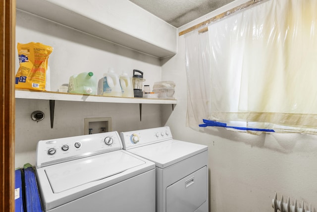 laundry room featuring separate washer and dryer and radiator heating unit