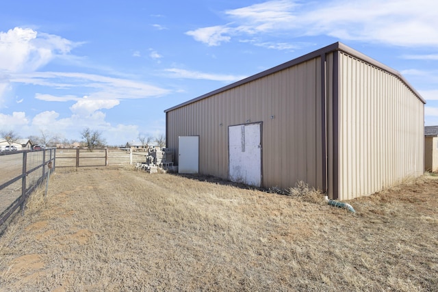 view of outbuilding with a rural view