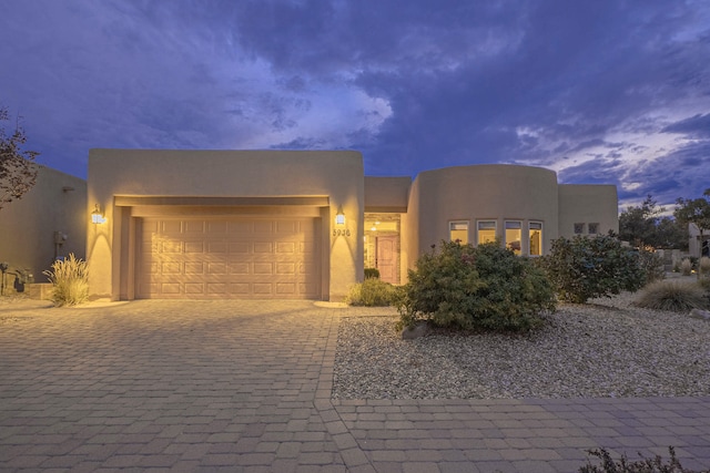 southwest-style home featuring a garage