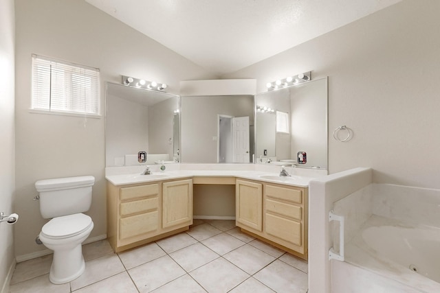 bathroom featuring tile patterned floors, a washtub, vanity, vaulted ceiling, and toilet