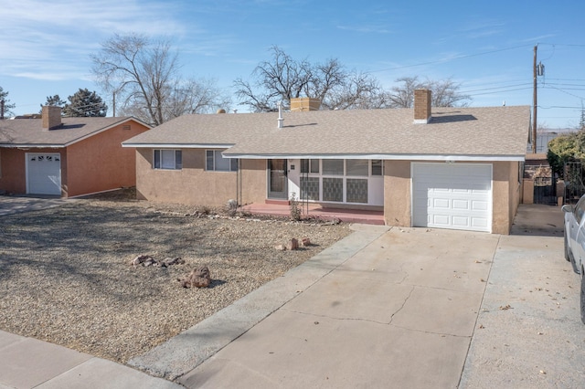 single story home with a garage, roof with shingles, concrete driveway, and stucco siding