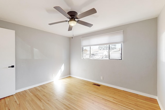 empty room with light hardwood / wood-style floors and ceiling fan