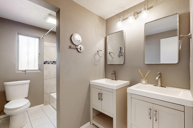 full bathroom with tile patterned flooring, two vanities, a sink, and toilet