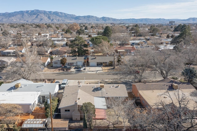 birds eye view of property with a mountain view and a residential view