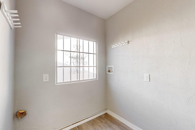 washroom with washer hookup and hardwood / wood-style floors