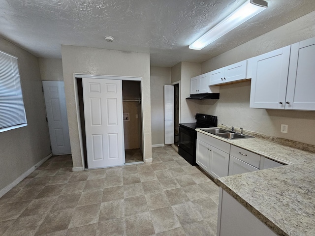 kitchen with a textured ceiling, white cabinetry, black / electric stove, and sink