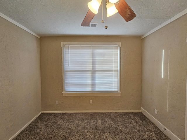 carpeted empty room with ceiling fan, a textured ceiling, and ornamental molding