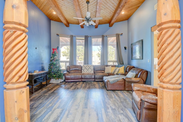 unfurnished living room with beamed ceiling, dark hardwood / wood-style flooring, ceiling fan, and wooden ceiling