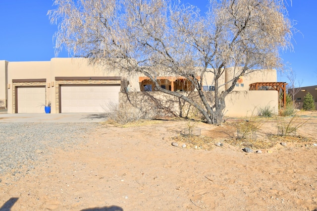 adobe home featuring a garage