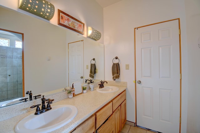 bathroom with tile patterned flooring and vanity