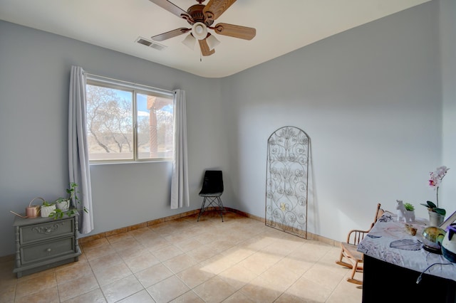 living area featuring ceiling fan