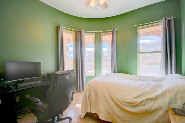 bedroom featuring ceiling fan and light tile patterned floors