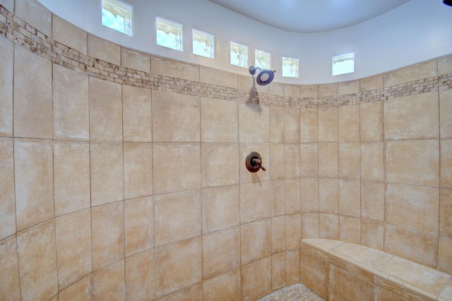 bathroom with tiled shower