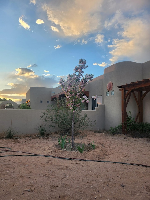 view of property exterior at dusk