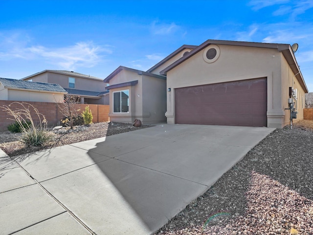 6409 Osprey Dr NE, Rio Rancho, NM 87144 - view of front facade featuring a garage