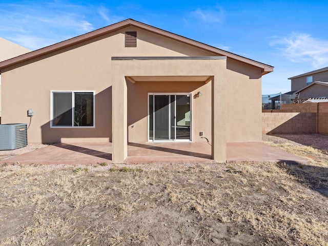 6409 Osprey Dr NE, Rio Rancho, NM 87144 - back of house featuring cooling unit and a patio