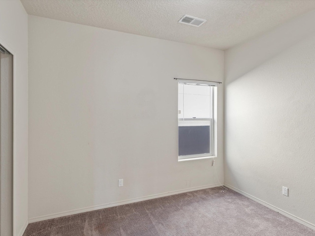 6409 Osprey Dr NE, Rio Rancho, NM 87144 - carpeted empty room featuring a textured ceiling