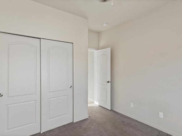 6409 Osprey Dr NE, Rio Rancho, NM 87144 - unfurnished bedroom featuring light carpet and a closet