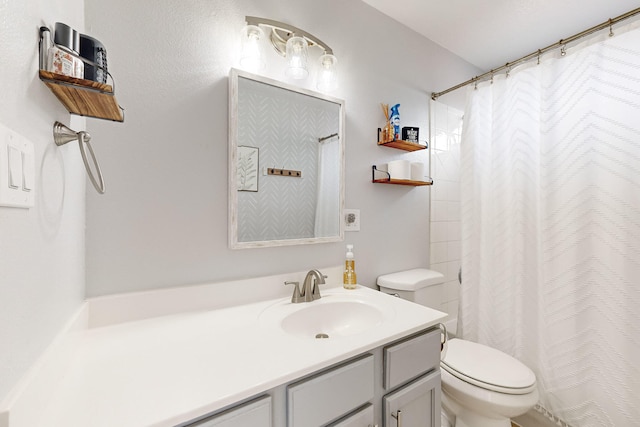 bathroom featuring a shower with curtain, vanity, and toilet