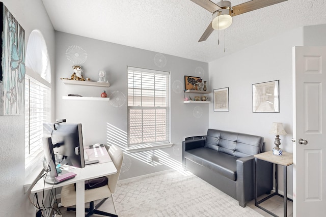 office area featuring a textured ceiling and ceiling fan