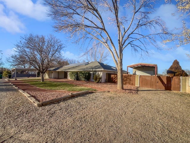 437 El Llano Ln NW, Los Ranchos, NM 87107 - view of front of property with a carport and solar panels