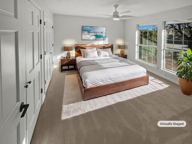 437 El Llano Ln NW, Los Ranchos, NM 87107 - carpeted bedroom with baseboards and ceiling fan