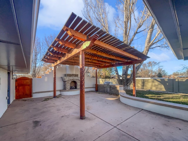 437 El Llano Ln NW, Los Ranchos, NM 87107 - view of patio with an outdoor stone fireplace, area for grilling, and a pergola