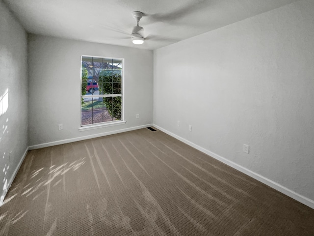 unfurnished room featuring carpet flooring and ceiling fan