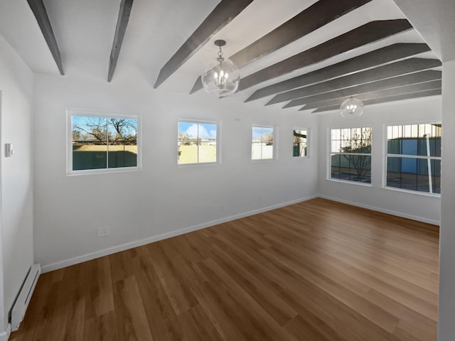 empty room featuring a chandelier, beam ceiling, hardwood / wood-style flooring, and baseboard heating