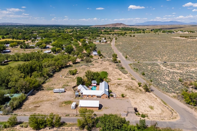 birds eye view of property with a mountain view