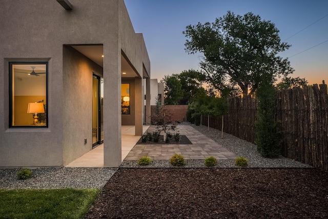 view of patio terrace at dusk