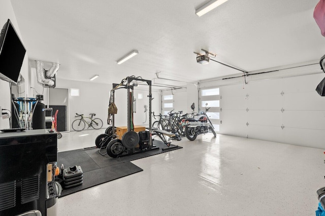 exercise room with a textured ceiling