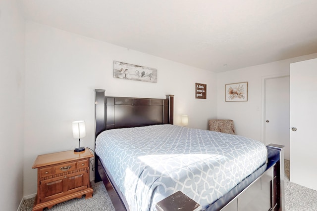 bedroom featuring light colored carpet