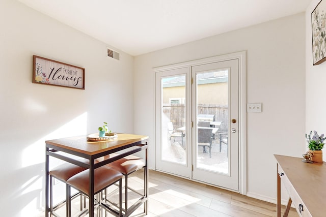 dining area with light hardwood / wood-style flooring