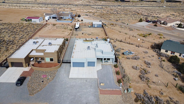 birds eye view of property with a desert view