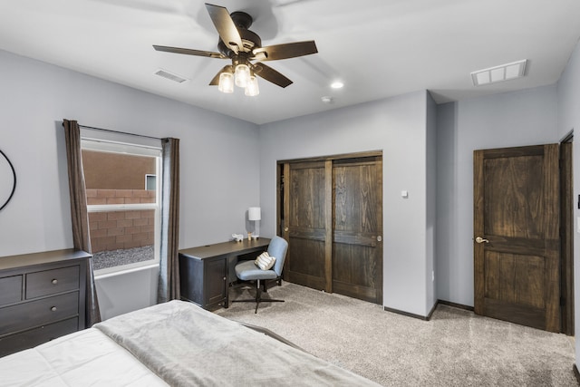 bedroom with baseboards, a closet, visible vents, and carpet flooring