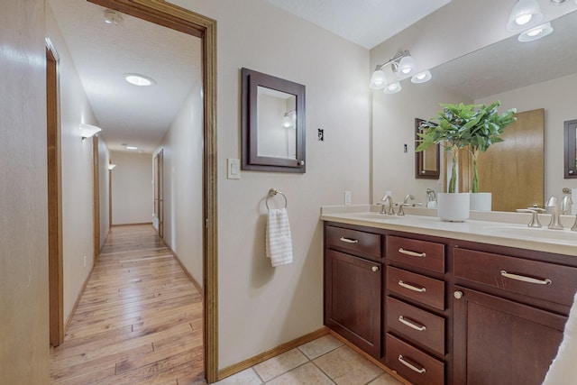 bathroom with vanity and wood-type flooring