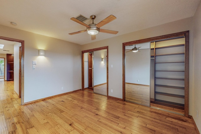 unfurnished bedroom featuring ceiling fan and light hardwood / wood-style floors