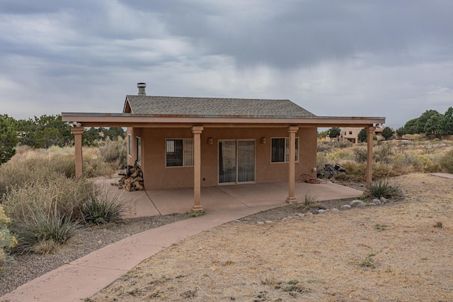 rear view of property with a patio area