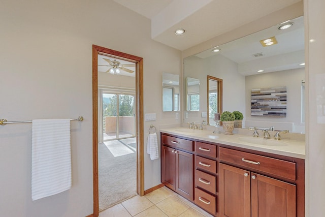 bathroom featuring tile patterned floors, ceiling fan, and vanity